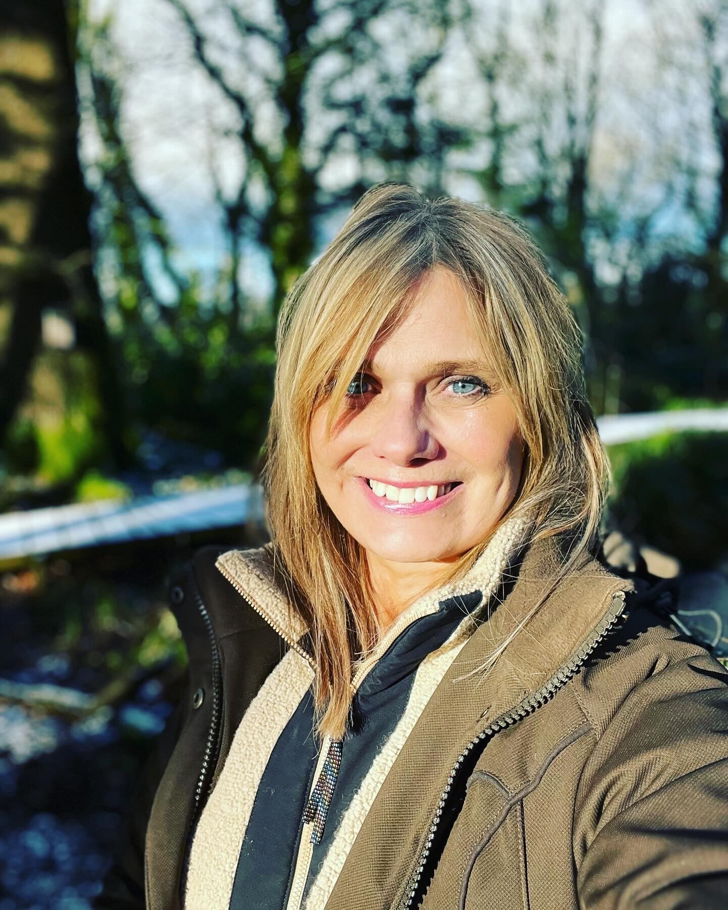 Elen Hughes Elen Hughes smiling into the camera, surrounded by nature