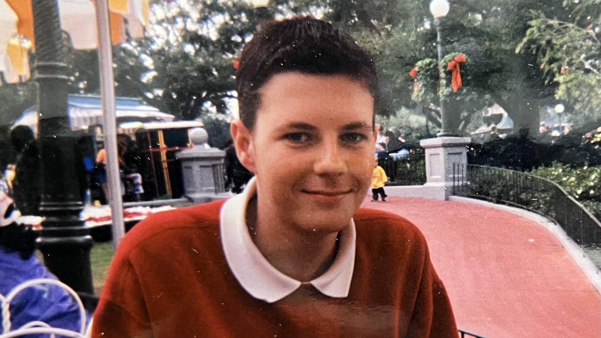 Chris Lucas Chris Lucas, a young man wearing a red sweater smiles at the camera.