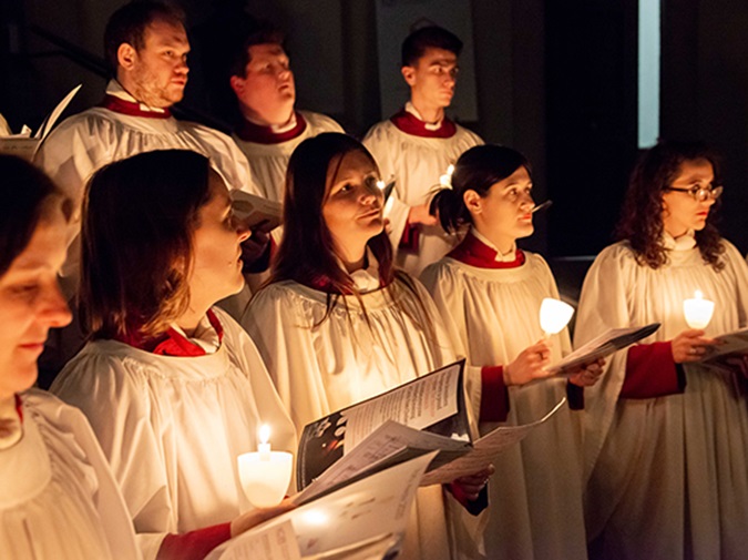 The 'Carols from Chelsea' choir singing by candlelight