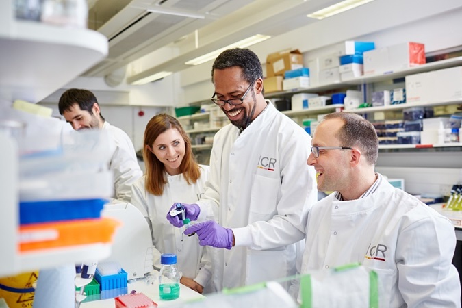 Scientists in lab - Four scientists working in a lab