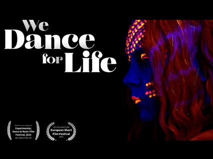 We Dance For Life with two laurels from film festivals. A person with fluorescent hair and make up.