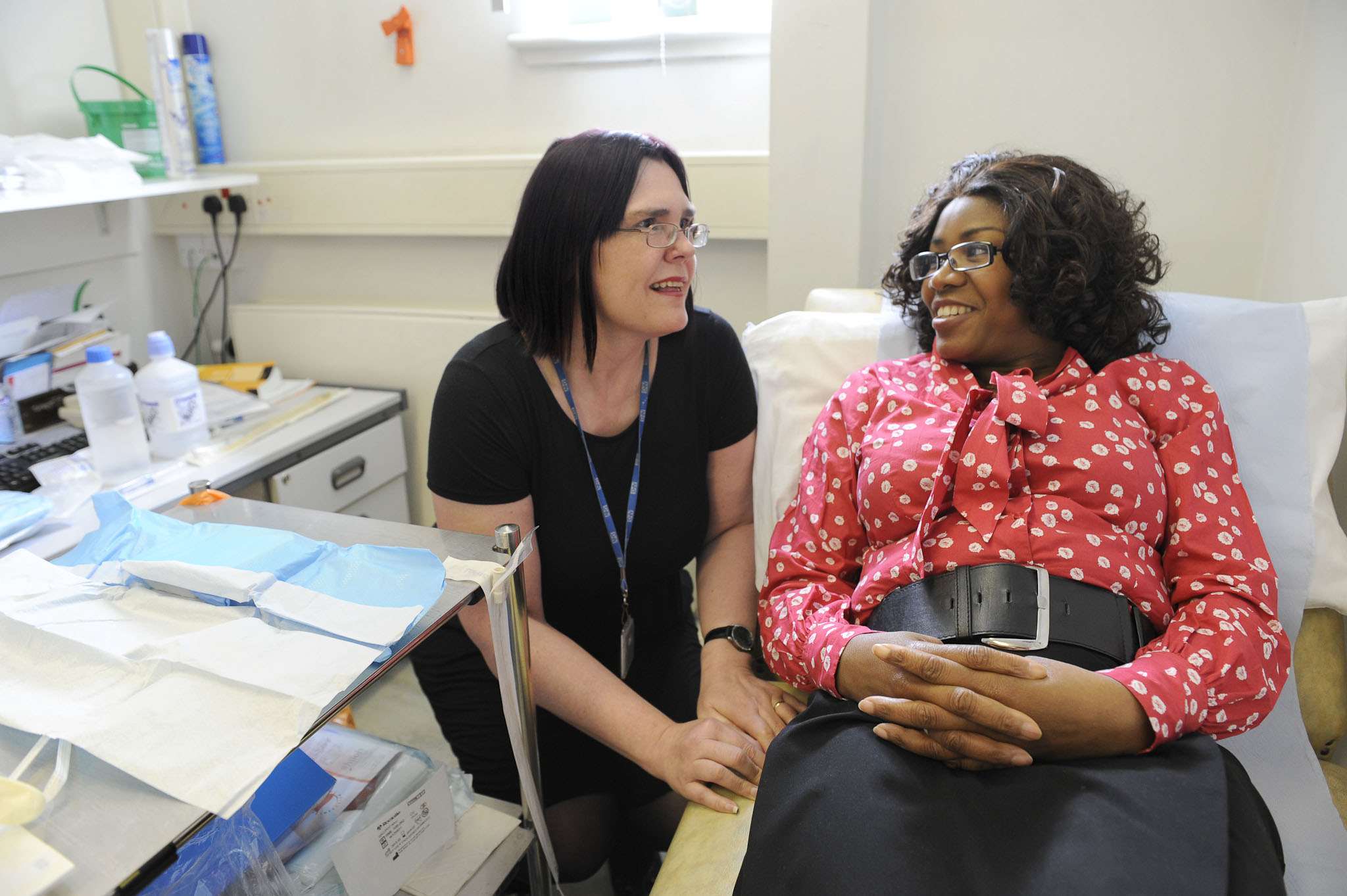 A clinician speaking with a patient.