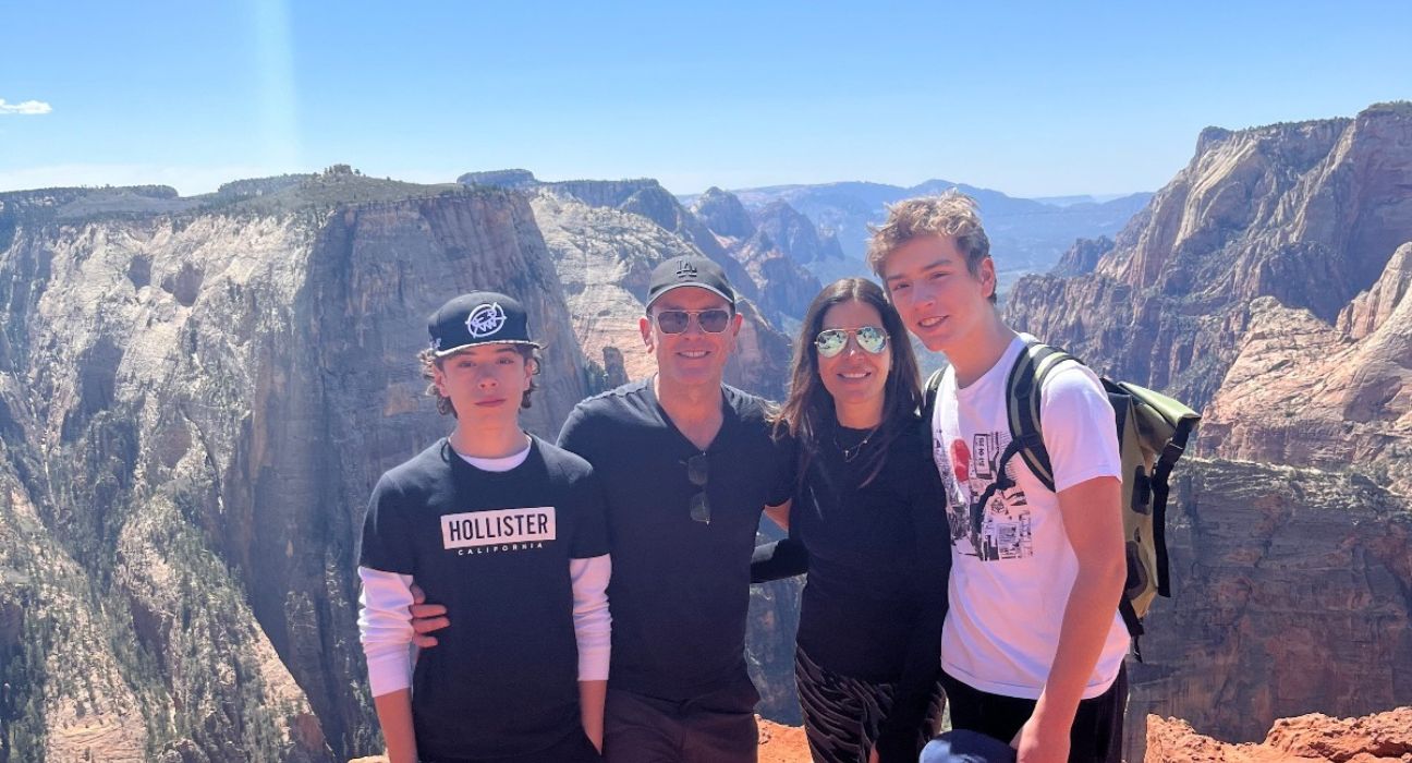 Yvonne Diaz with her husband and twin sons on holiday in the mountains - cropped