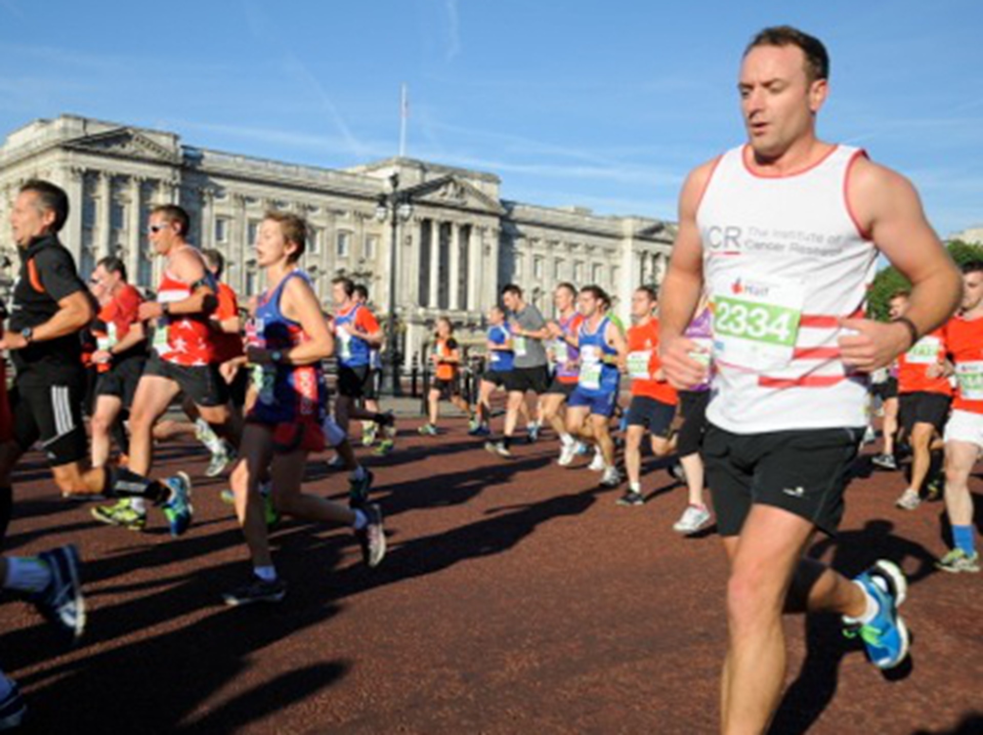 Running past Buckingham Palace on the Royal Parks Half Marathon