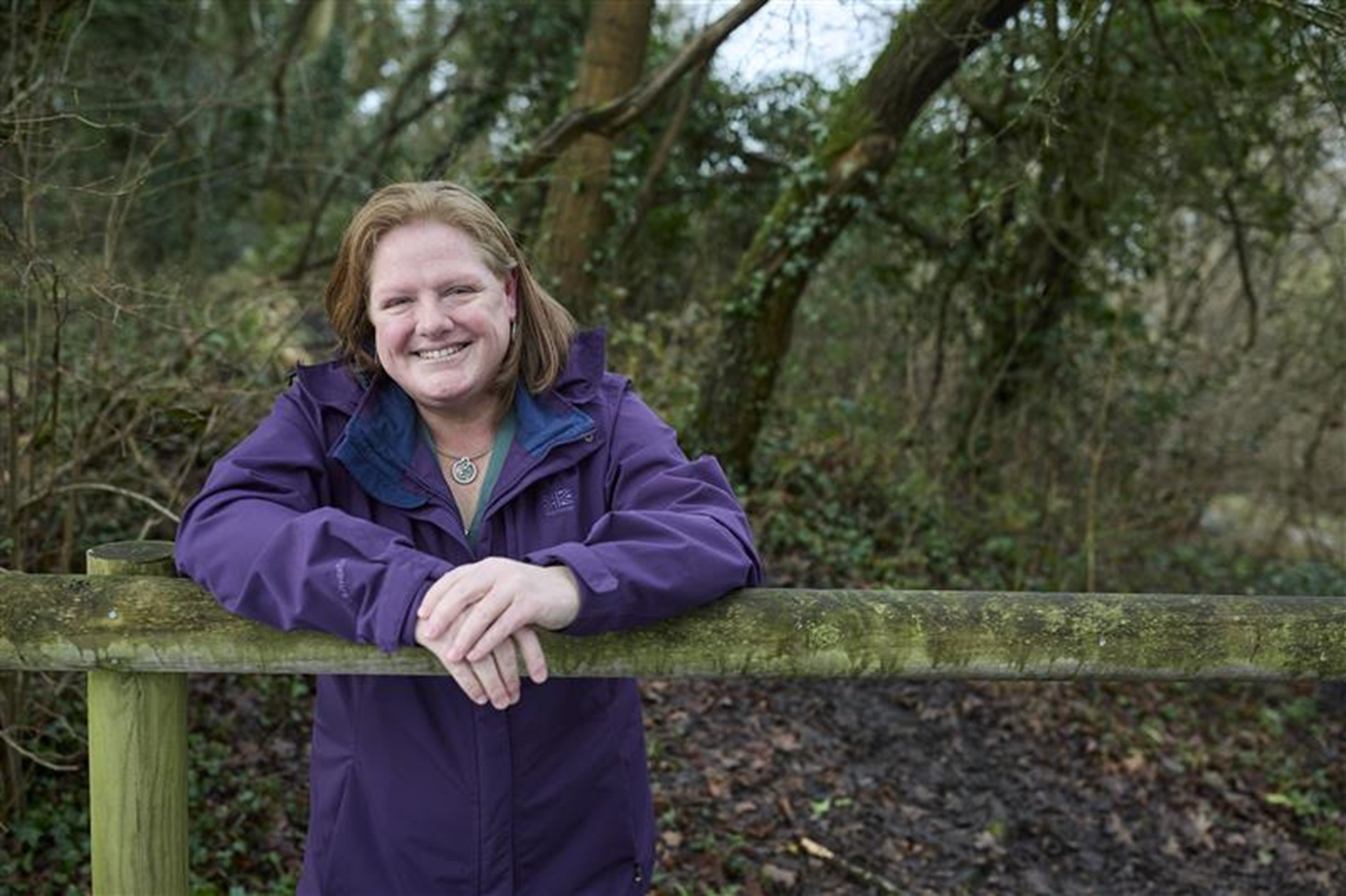 Cecelia smiling in a woodland background