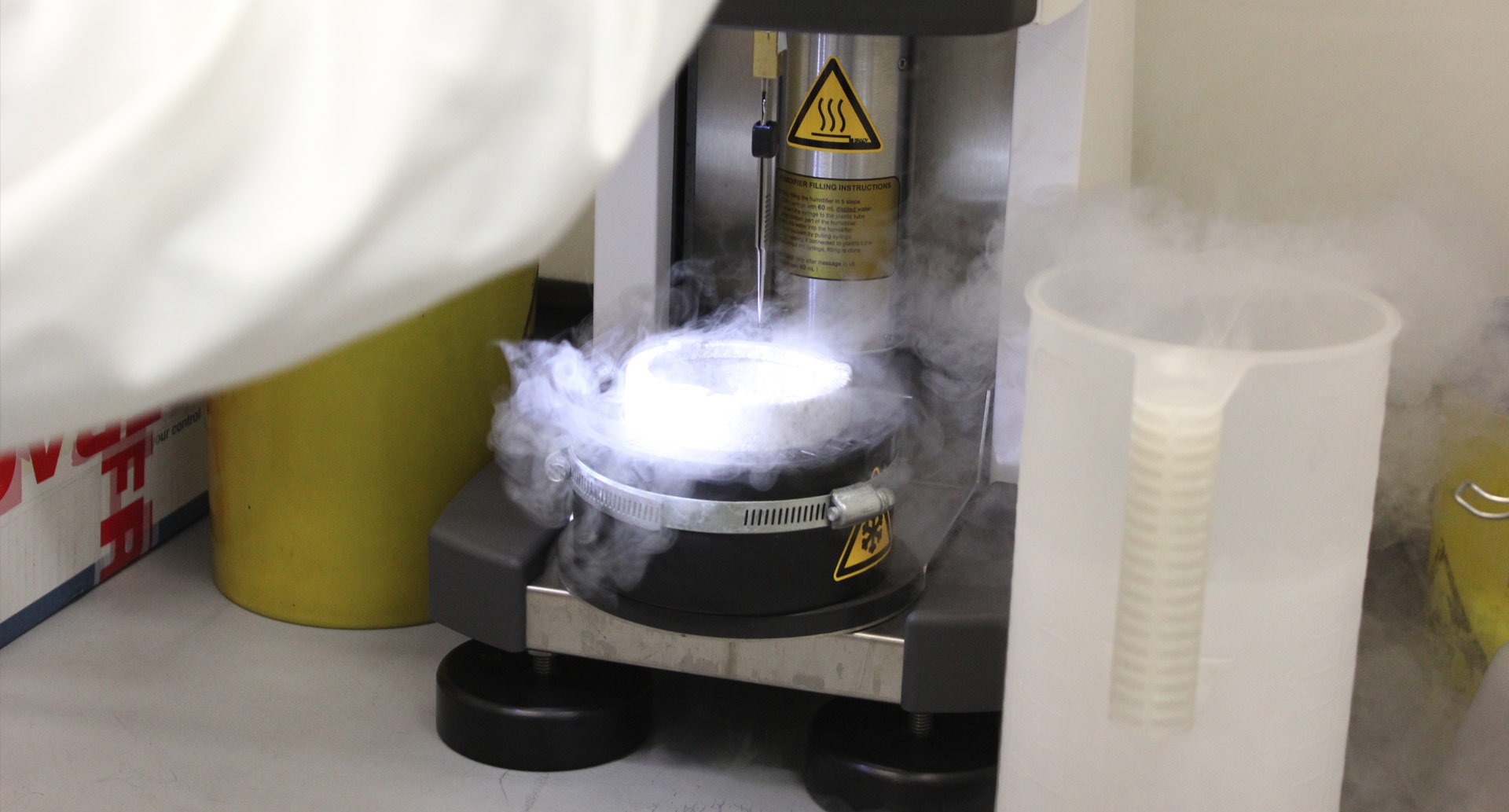 Researcher using cryo-electron microscopy equipment