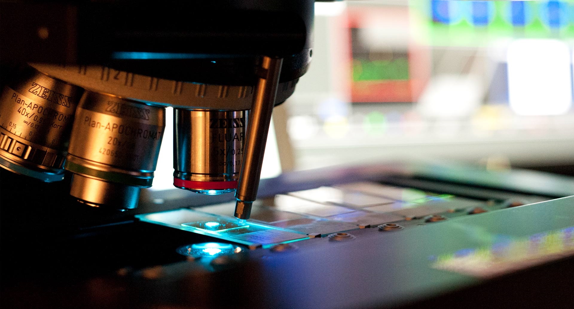 Close-up of microscope lenses and slides