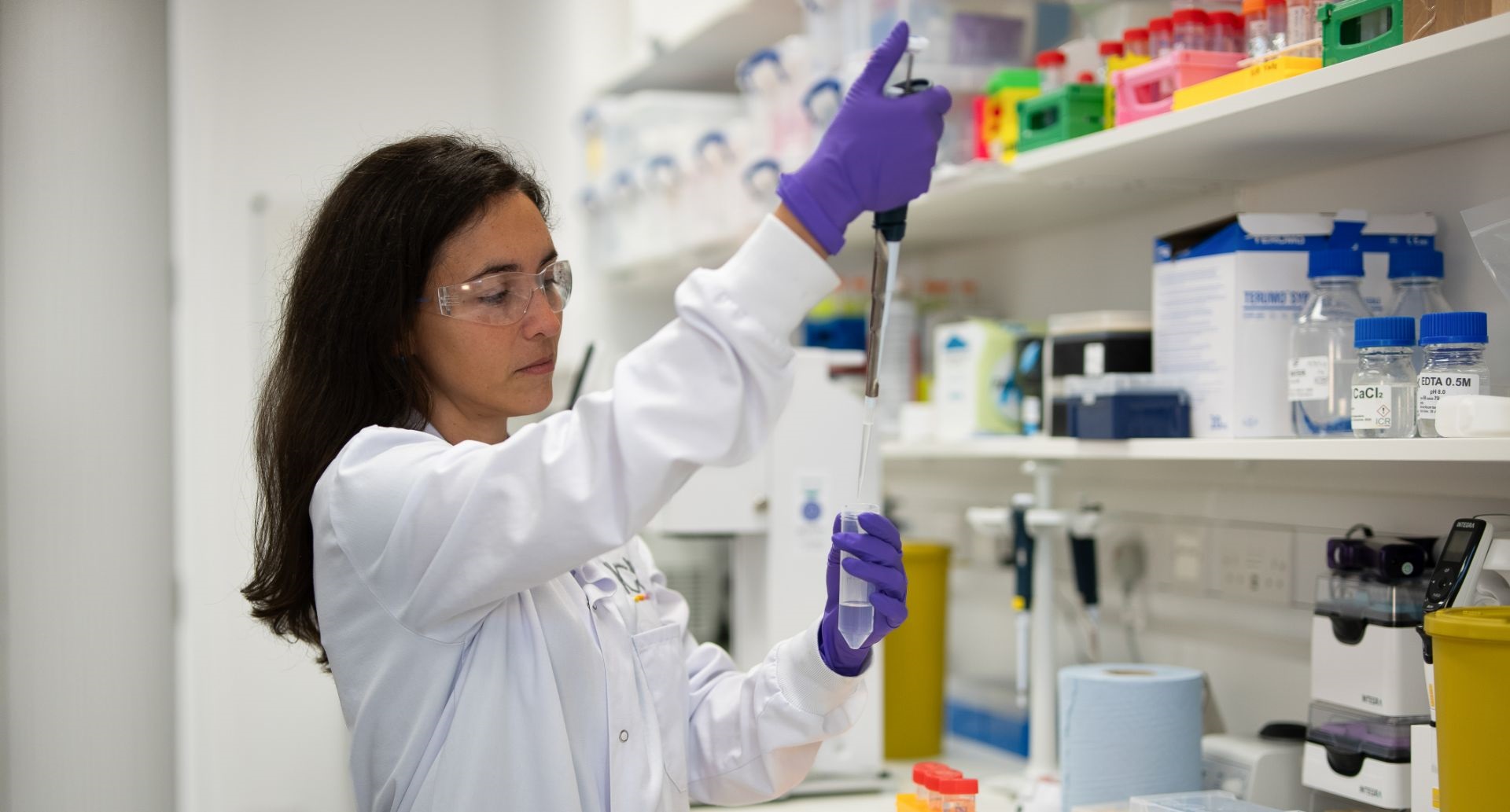 Scientist pipetting in lab