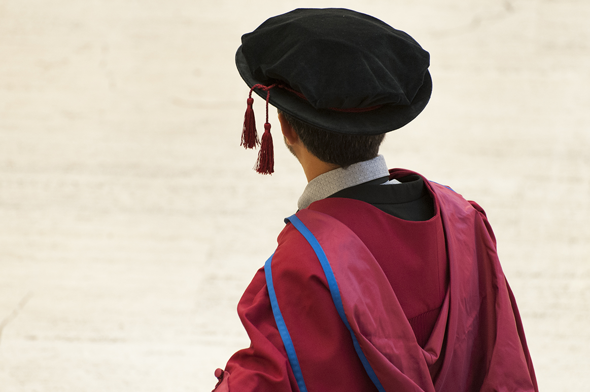 The back of a graduating ICR student's head at an ICR award ceremony.