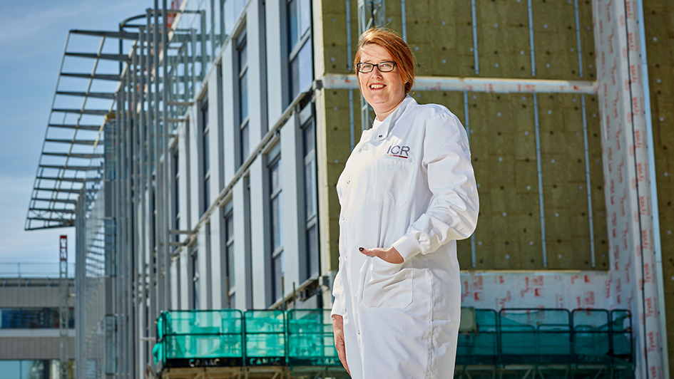 Dr Olivia Rossanese standing in front of the Centre for Cancer Drug Discovery