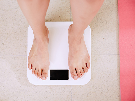 Feet on digital weighing scale