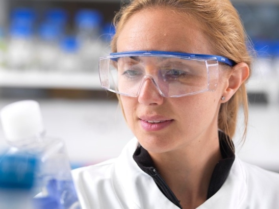 a woman working in a laboratory