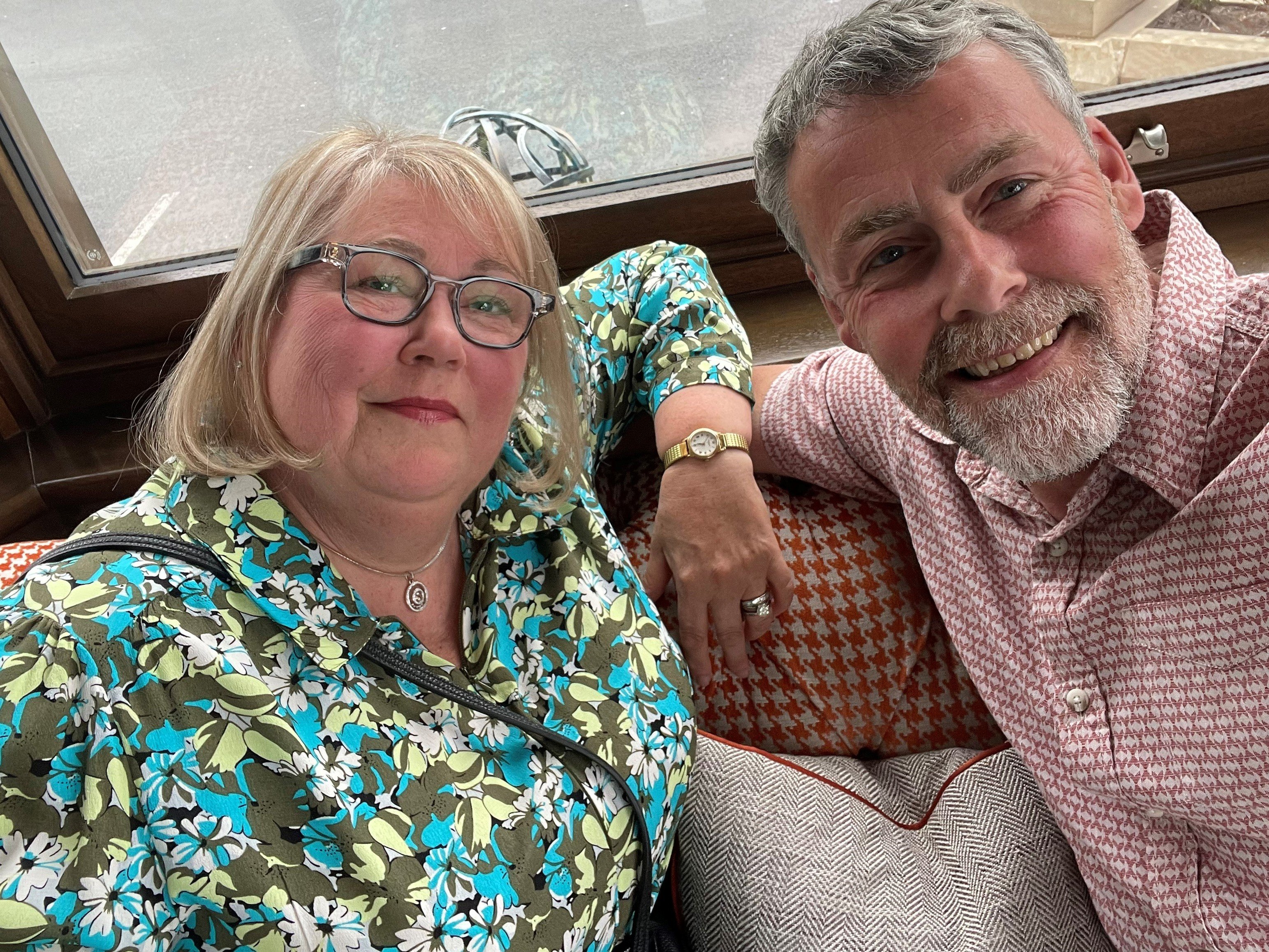 Glenys and her husband David smile for a selfie