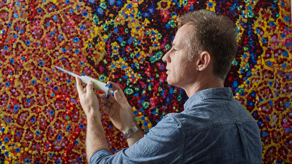 Artist James Cochran painting with a laboratory pipette