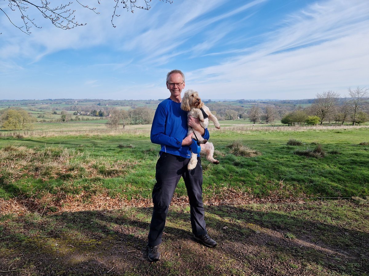 John Dabell with his dog outside in the sunshine