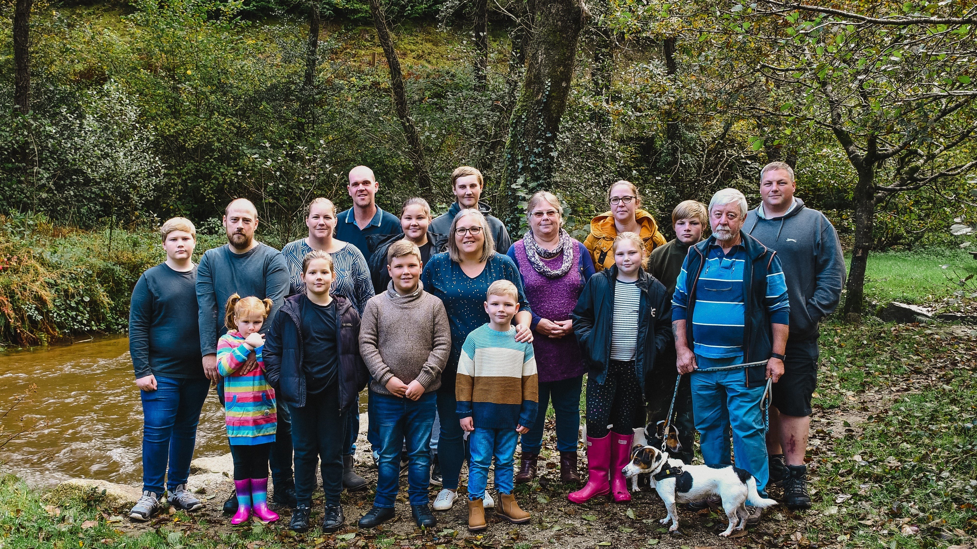 Maggie at the centre of the image, surrounded by her extended family