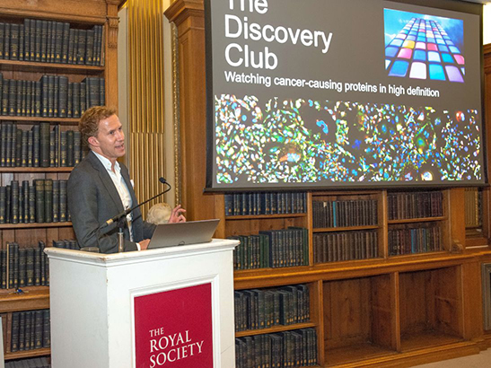 Professor Chris Bakal speaking at The Discovery Club 2019 547x410px