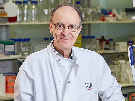 Professor Mel Greaves in lab coat