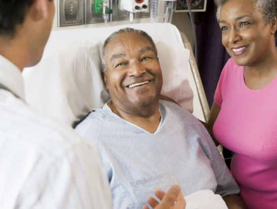 Prostate cancer patient with doctor and wife