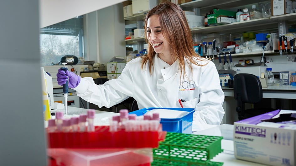 Scientist pipetting in a lab