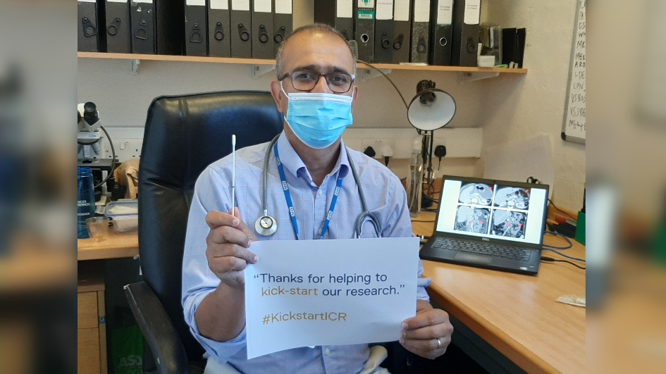 Udai Banerji holding a KickstartICR sign