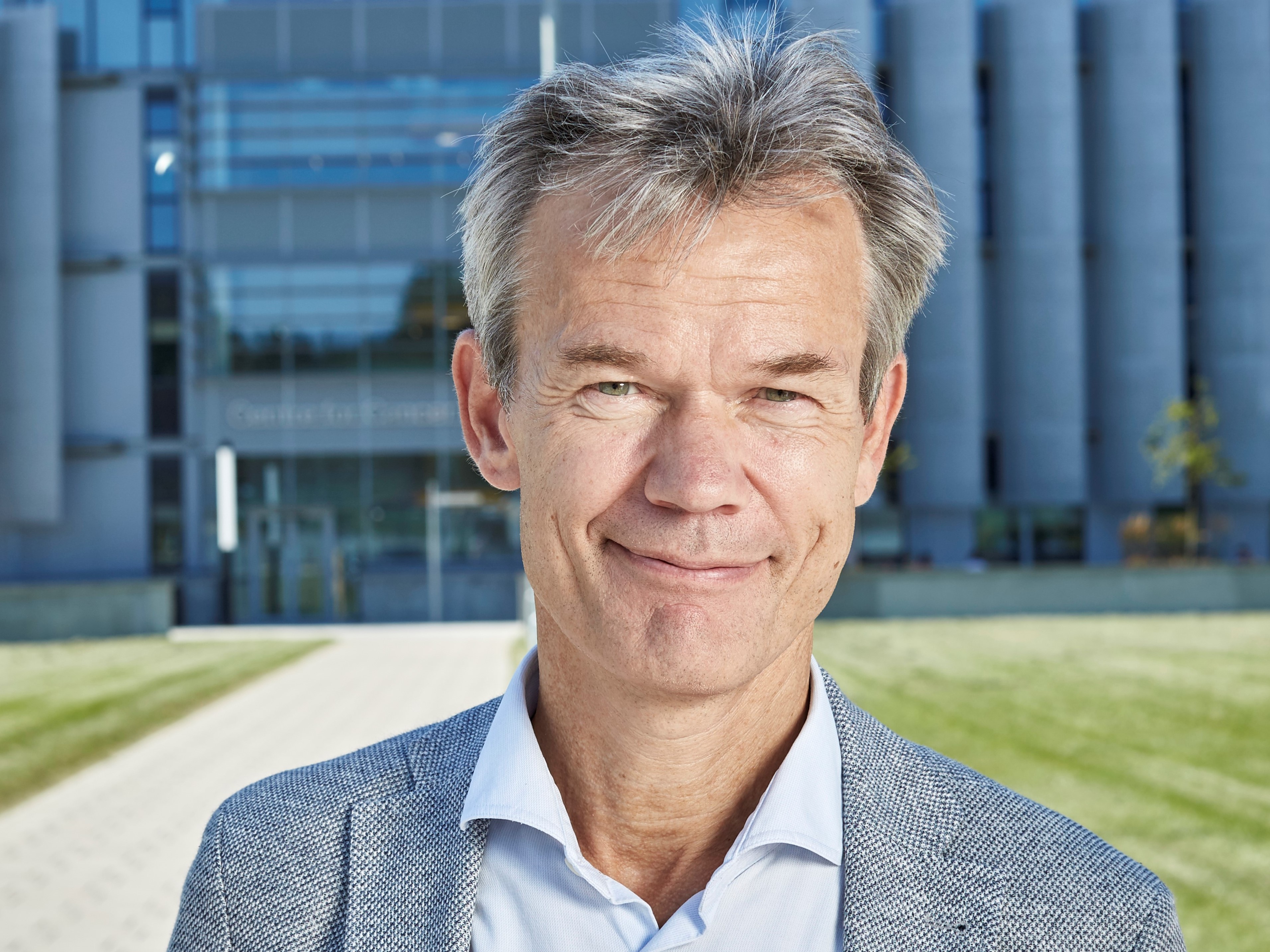 Professor Kristian Helin, head and shoulders in frame, stood in front of the ICR's Centre for Cancer Drug Discovery