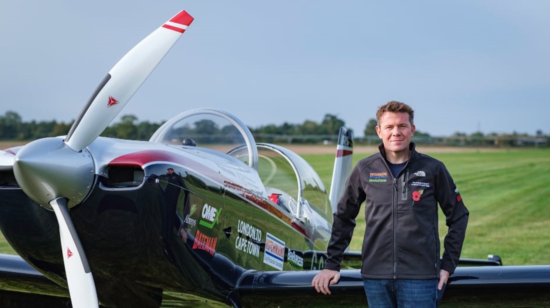 Giles Abrey next to his plane